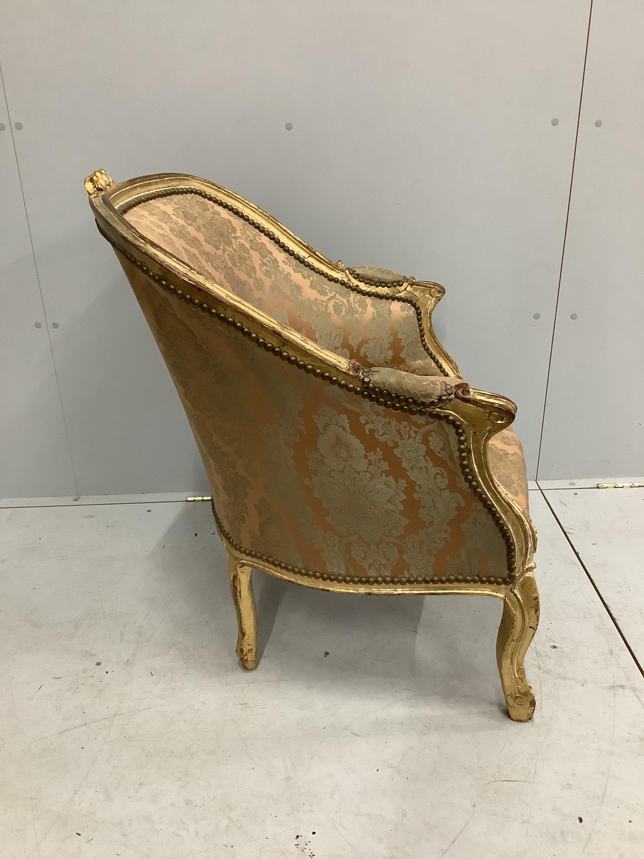 A Louis XVI style carved giltwood tub framed chair, width 66cm, depth 66cm, height 87cm